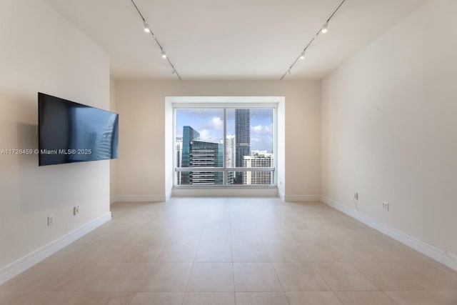 empty room featuring light tile patterned floors