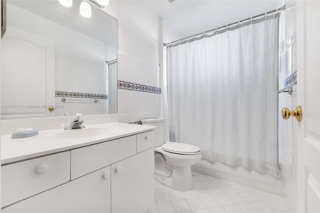 full bathroom featuring toilet, tile patterned flooring, shower / bath combo with shower curtain, and vanity