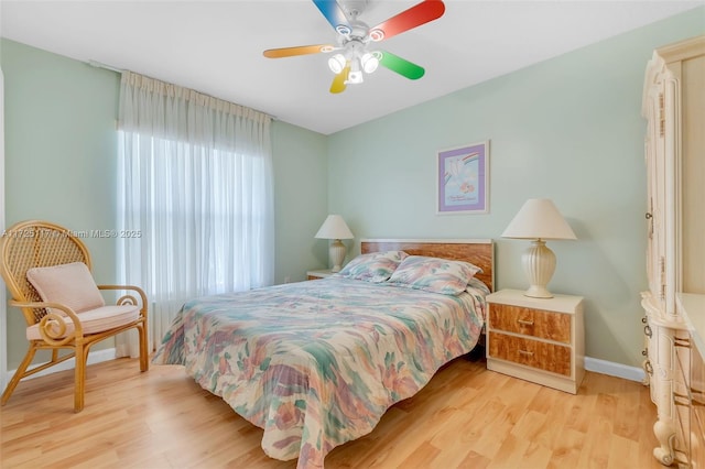 bedroom with ceiling fan and light hardwood / wood-style flooring