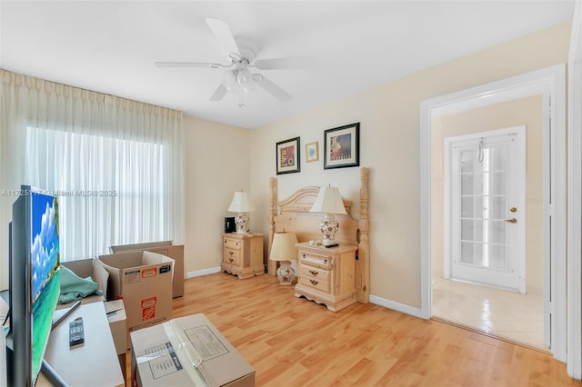 interior space with ceiling fan and wood-type flooring