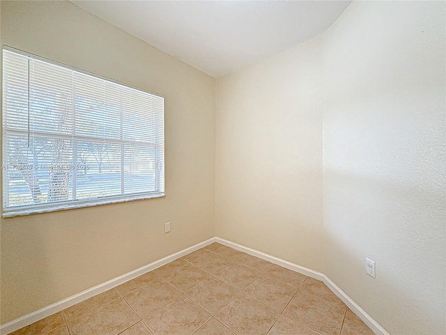 empty room featuring light tile patterned floors