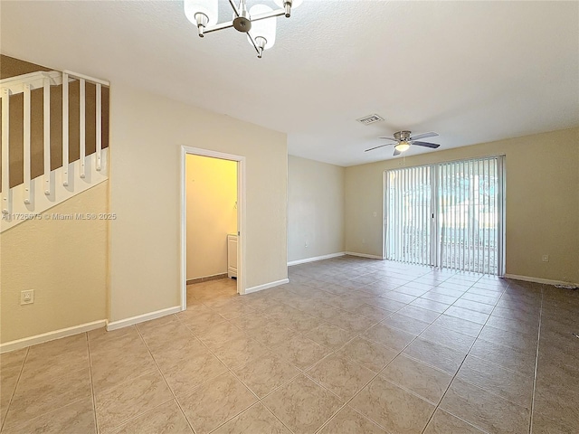 empty room with light tile patterned flooring and ceiling fan