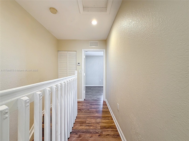 corridor with dark hardwood / wood-style floors