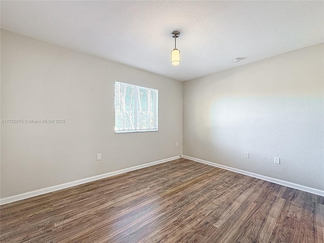 empty room featuring dark hardwood / wood-style floors