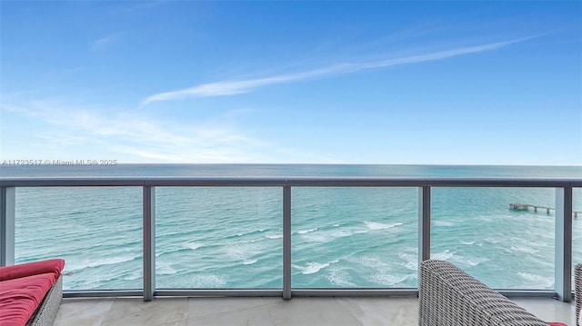 balcony featuring a water view