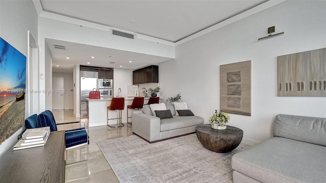 living room with ornamental molding