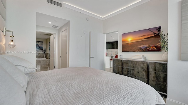 bedroom featuring ensuite bath