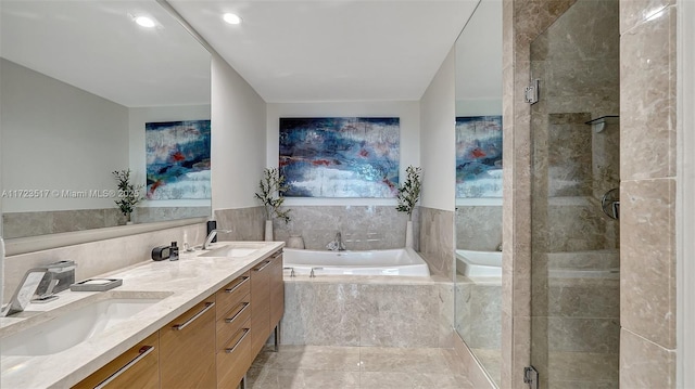 bathroom featuring separate shower and tub and vanity