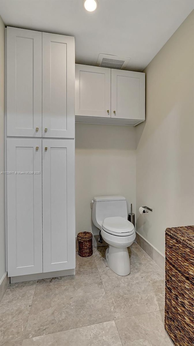 bathroom featuring toilet