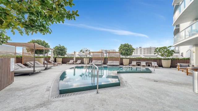 view of swimming pool featuring a patio