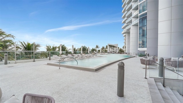 view of pool featuring a patio