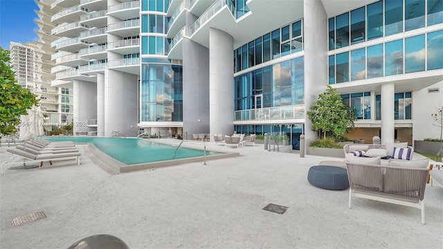 view of swimming pool with a patio area