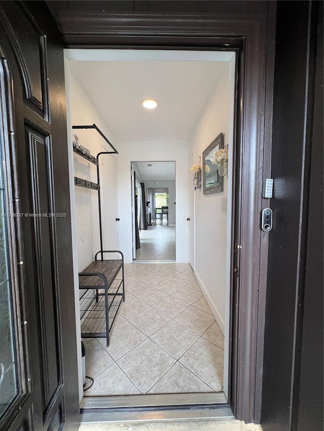 hallway with light tile patterned flooring