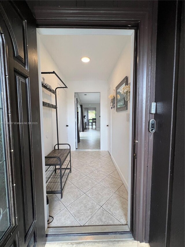 9541 W Daffodil Ln Unit 0, Miramar, FL 33025 - corridor with light tile patterned floors and baseboards