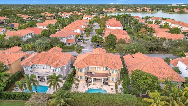 aerial view with a water view and a residential view