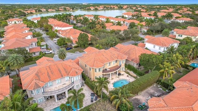 bird's eye view featuring a water view and a residential view