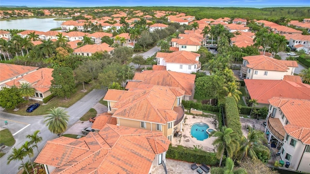 bird's eye view with a water view and a residential view