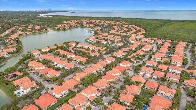 aerial view featuring a water view and a residential view