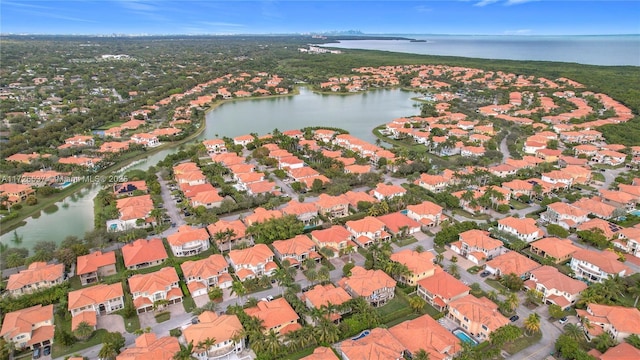 bird's eye view with a water view and a residential view