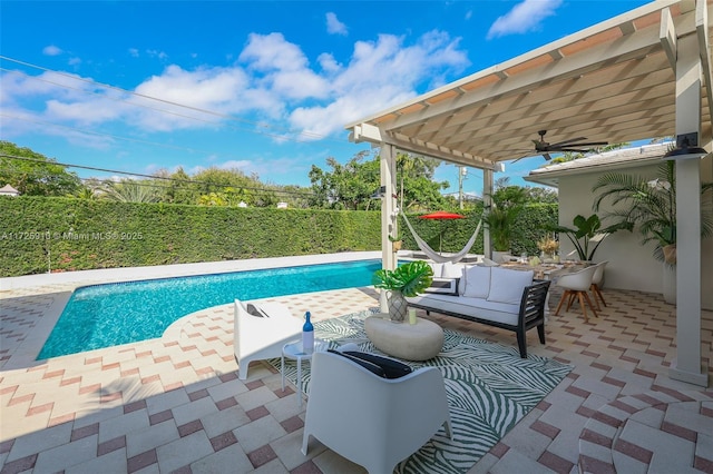 view of swimming pool with ceiling fan, an outdoor hangout area, a pergola, and a patio area