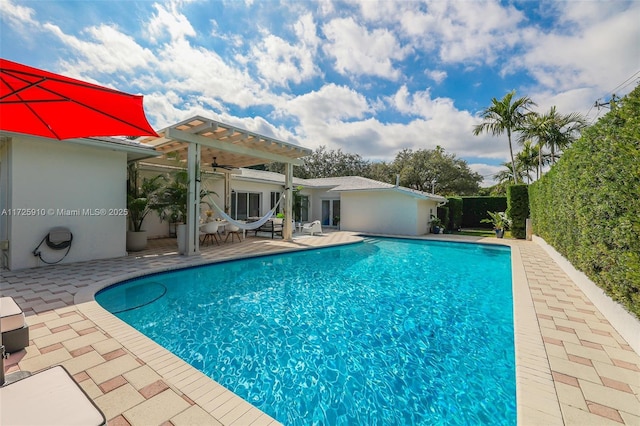 view of pool with a patio and a pergola