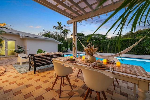 view of patio with outdoor lounge area and a pergola