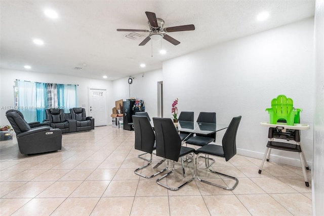 dining area with ceiling fan and light tile patterned floors