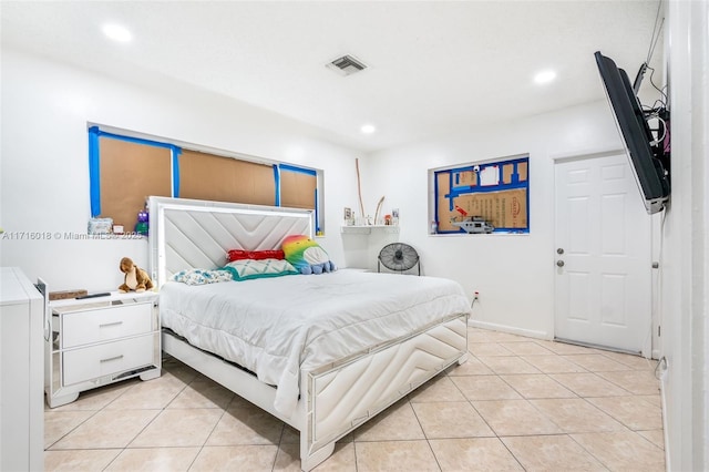 bedroom featuring light tile patterned flooring