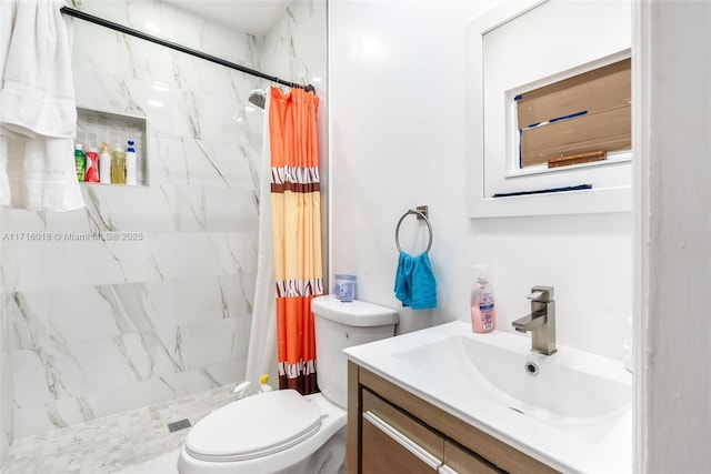 bathroom featuring vanity, curtained shower, and toilet