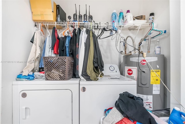 laundry room with washer and dryer and water heater