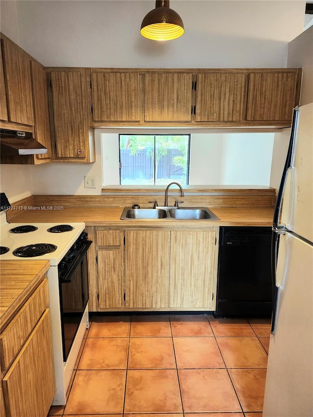 kitchen featuring range with electric stovetop, light tile patterned floors, white refrigerator, black dishwasher, and sink