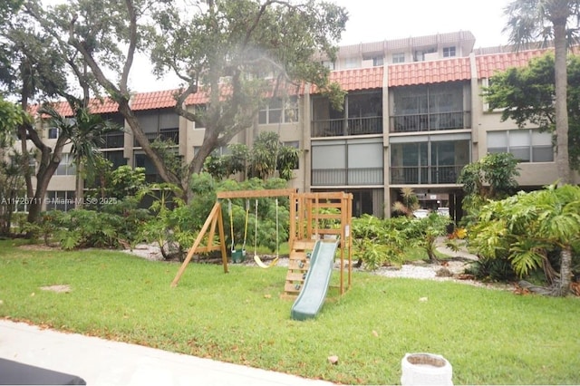 view of playground with a yard