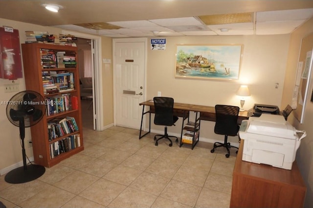 office area with a paneled ceiling