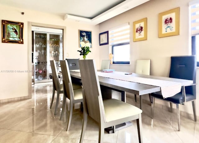 dining area featuring light tile patterned floors