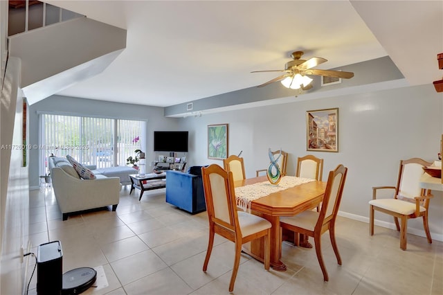 dining space with ceiling fan and light tile patterned floors