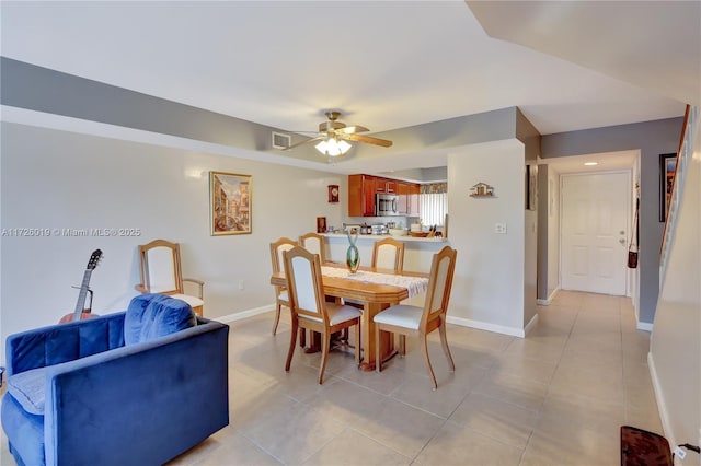 dining room featuring ceiling fan and light tile patterned floors