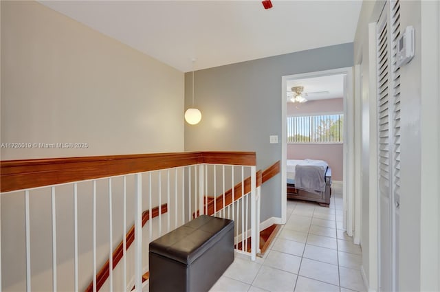 hallway with light tile patterned floors