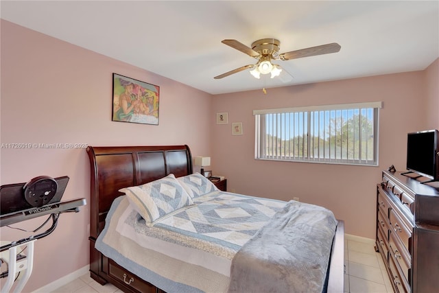 tiled bedroom featuring ceiling fan