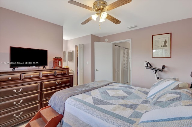 bedroom with ceiling fan and a closet