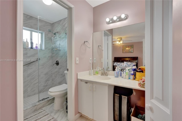 bathroom with toilet, ceiling fan, walk in shower, and vanity