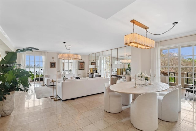 dining room featuring ornamental molding, light tile patterned flooring, and a chandelier