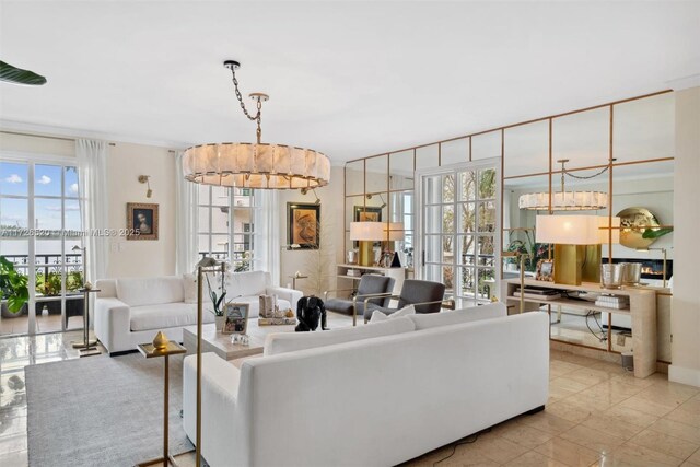 living room with an inviting chandelier and a healthy amount of sunlight