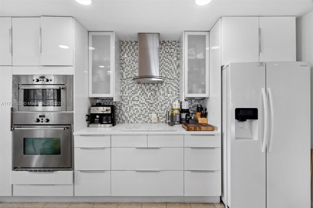 kitchen with white cabinets, pendant lighting, and a chandelier