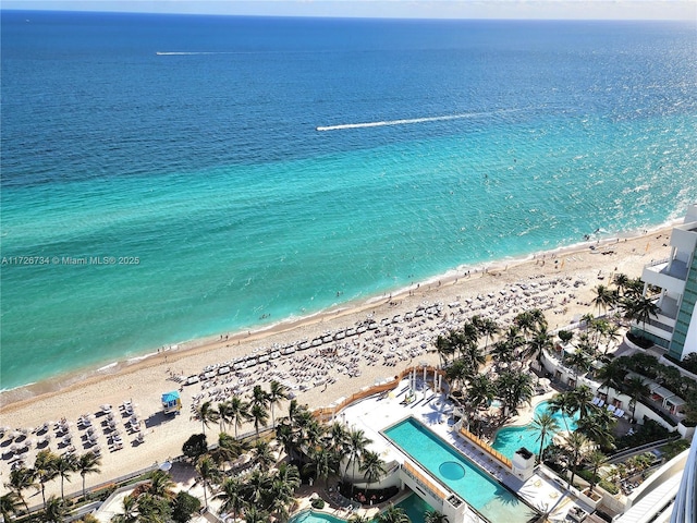 bird's eye view with a water view and a view of the beach