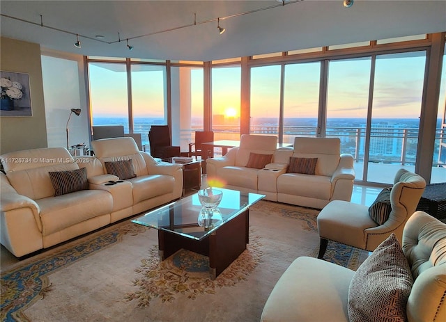 3535 S Ocean Dr Unit 2805, Hollywood, FL 33019 - living room with rail lighting, a water view, floor to ceiling windows, and healthy amount of natural light