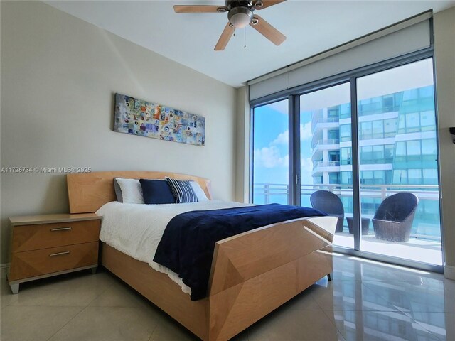 tiled bedroom featuring ceiling fan and access to exterior