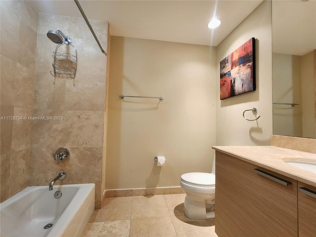 full bathroom with vanity, tile patterned flooring, tiled shower / bath, and toilet