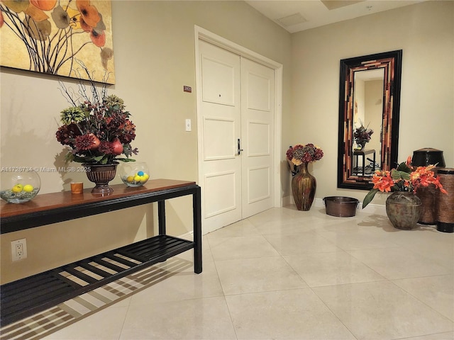 foyer with light tile patterned floors