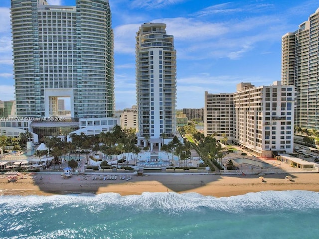 exterior space with a water view and a view of the beach