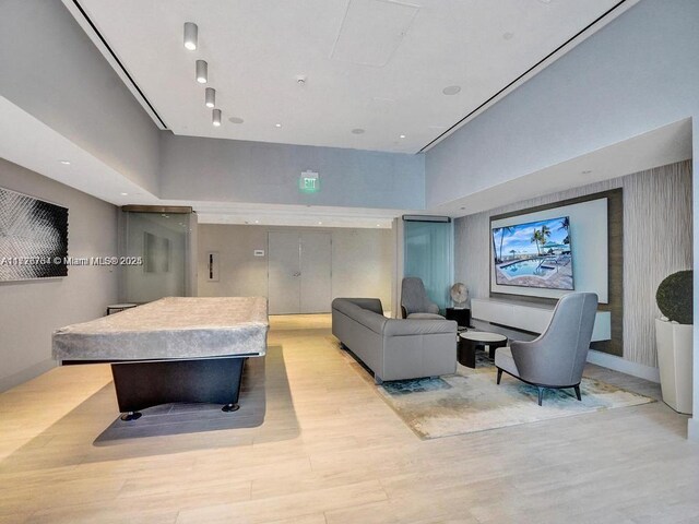 interior space featuring light wood-type flooring and billiards